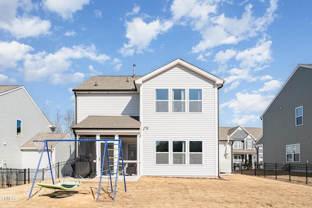 rear view of property with a patio, a trampoline, a fenced backyard, and roof with shingles