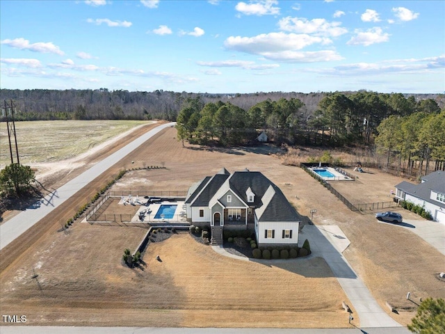 bird's eye view featuring a wooded view