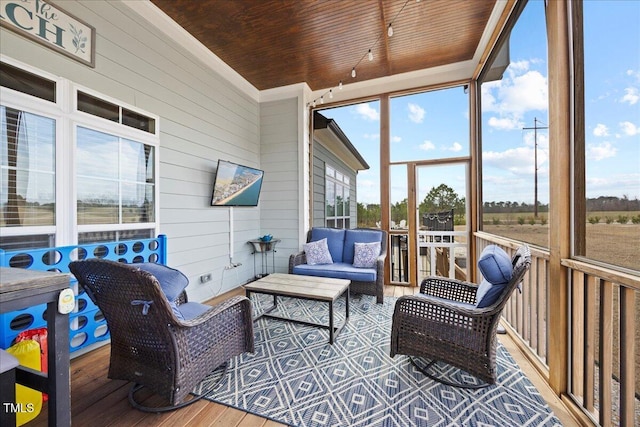 sunroom featuring wooden ceiling