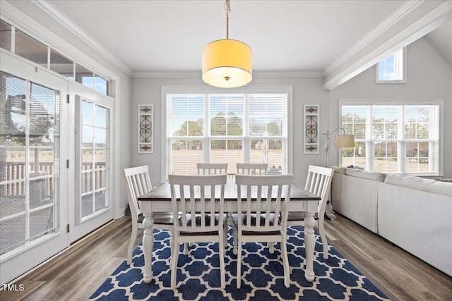 dining room featuring ornamental molding and wood finished floors