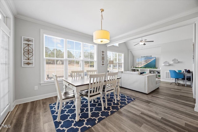 dining area with visible vents, baseboards, vaulted ceiling, and wood finished floors