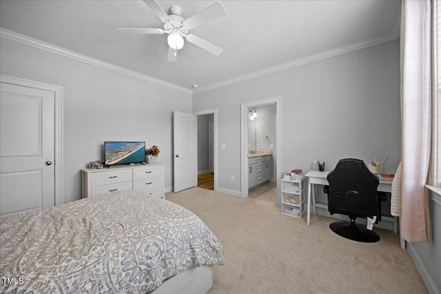 bedroom with ceiling fan, light carpet, baseboards, ensuite bath, and crown molding