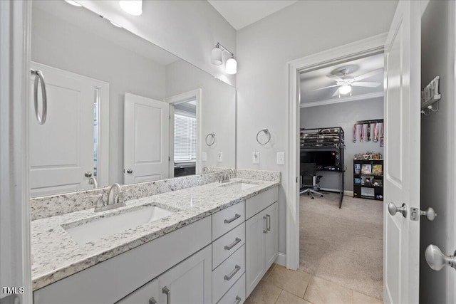 full bath with double vanity, ornamental molding, tile patterned flooring, and a sink