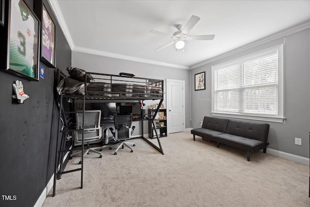 carpeted bedroom with baseboards, ornamental molding, and ceiling fan