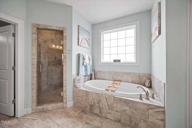 bathroom featuring a stall shower and a garden tub