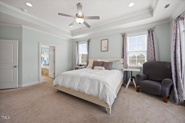 bedroom with baseboards, visible vents, a raised ceiling, light colored carpet, and ornamental molding