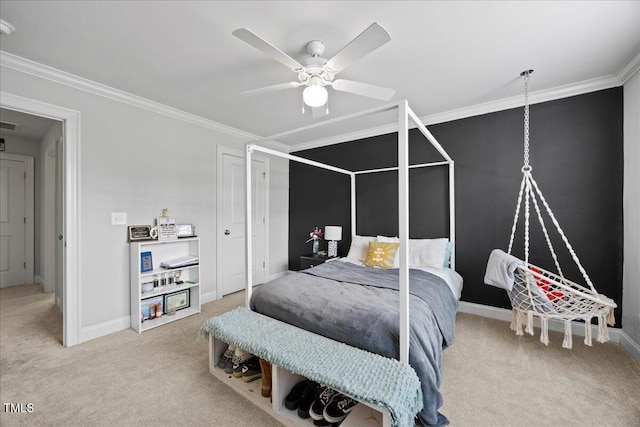 bedroom with baseboards, carpet floors, ceiling fan, and crown molding