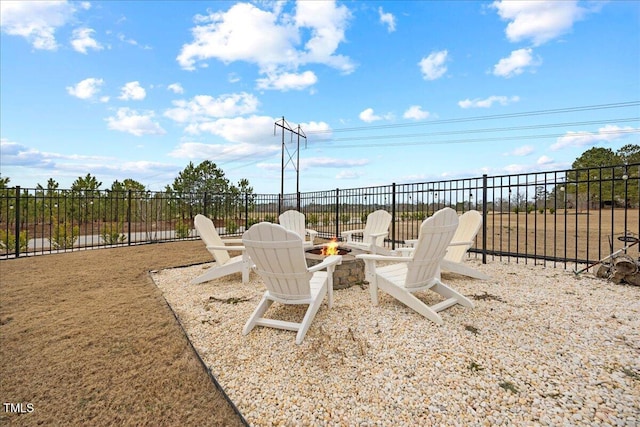 view of patio / terrace with an outdoor fire pit and fence