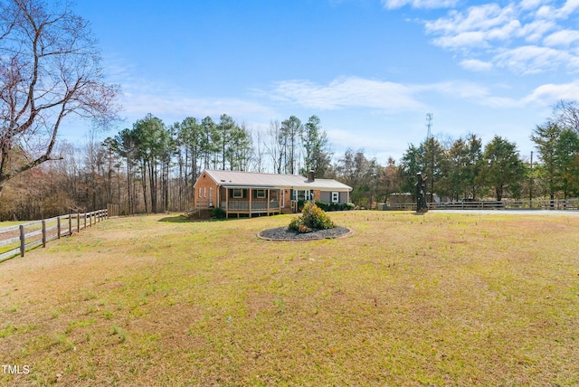 view of yard with fence and a wooden deck