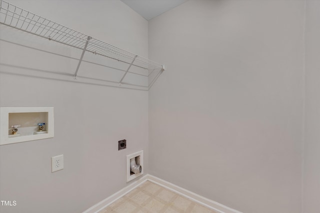 laundry area featuring hookup for a washing machine, laundry area, baseboards, light floors, and electric dryer hookup