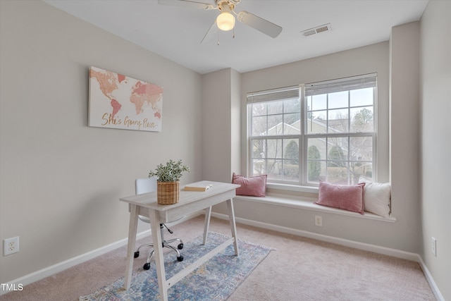 office featuring a ceiling fan, baseboards, visible vents, and carpet flooring