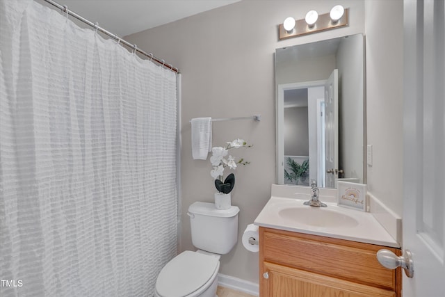 full bathroom featuring toilet, vanity, and a shower with curtain