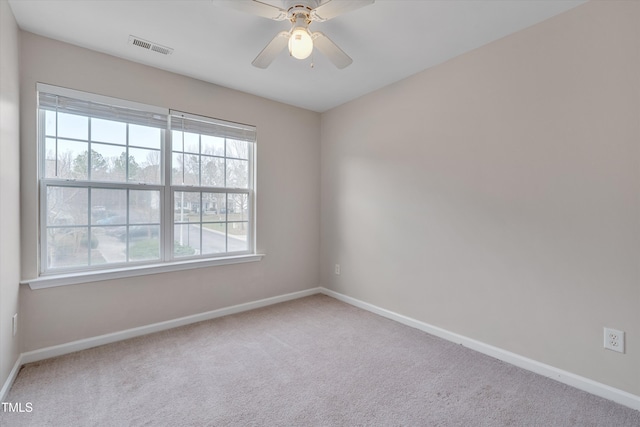 spare room with carpet flooring and baseboards