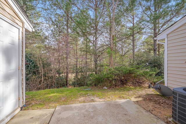 view of yard featuring a patio area and cooling unit