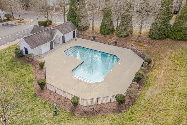 community pool featuring fence and a patio