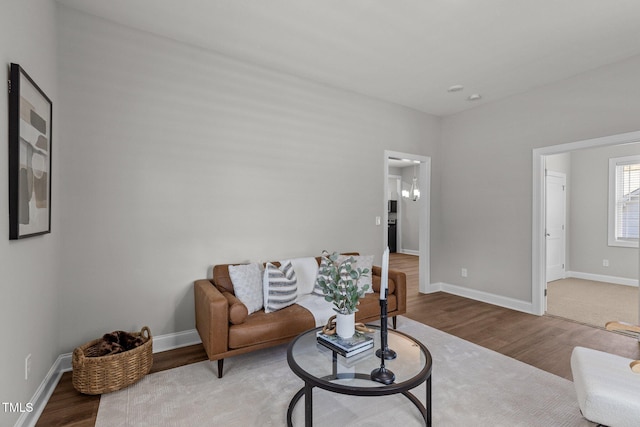 living area featuring wood finished floors and baseboards