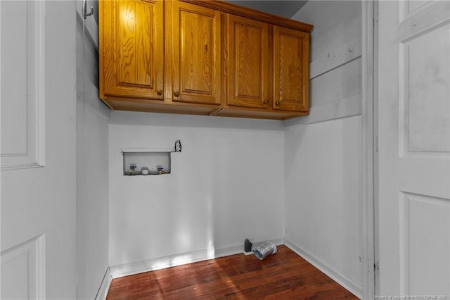 laundry room featuring cabinet space, baseboards, washer hookup, and dark wood finished floors