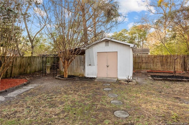view of shed featuring a fenced backyard