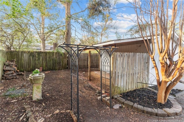 view of yard with an outbuilding and a fenced backyard