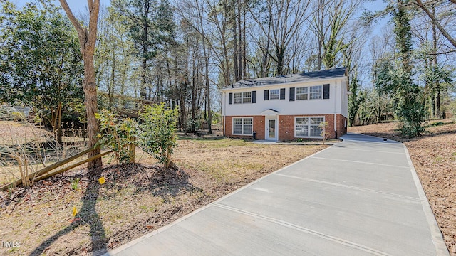 colonial home with brick siding