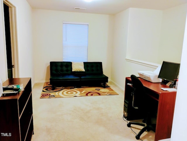 office featuring carpet, visible vents, and baseboards