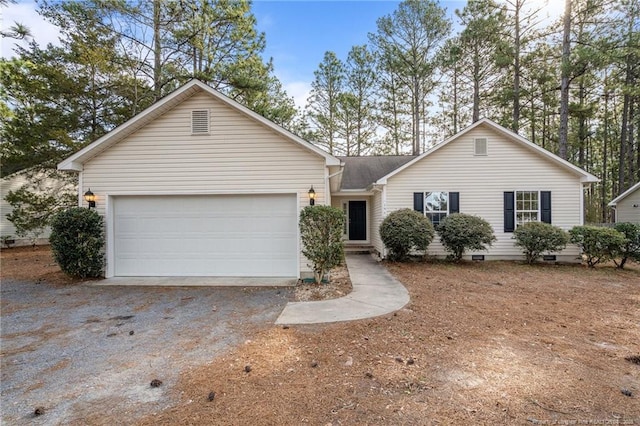 ranch-style house with a garage and driveway