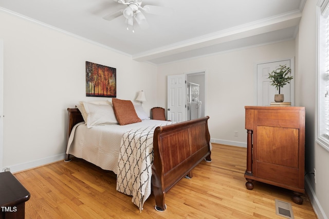 bedroom featuring ornamental molding, visible vents, and light wood finished floors