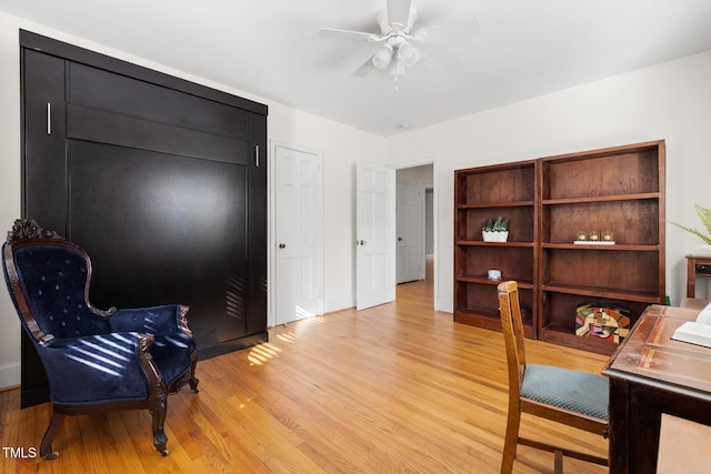 office space featuring a ceiling fan and light wood finished floors