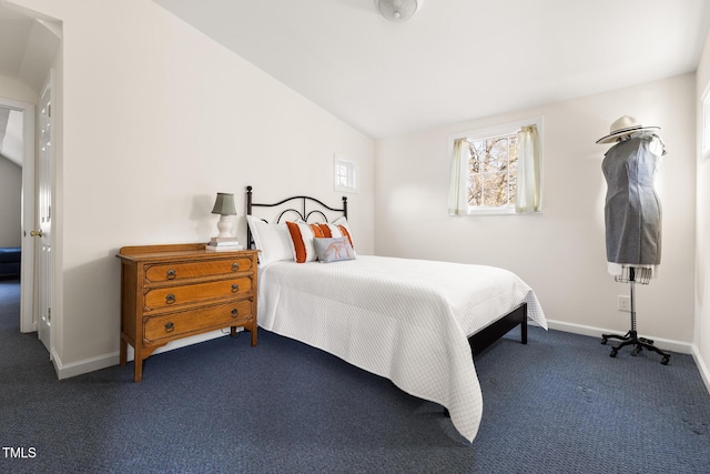 bedroom featuring carpet, vaulted ceiling, and baseboards