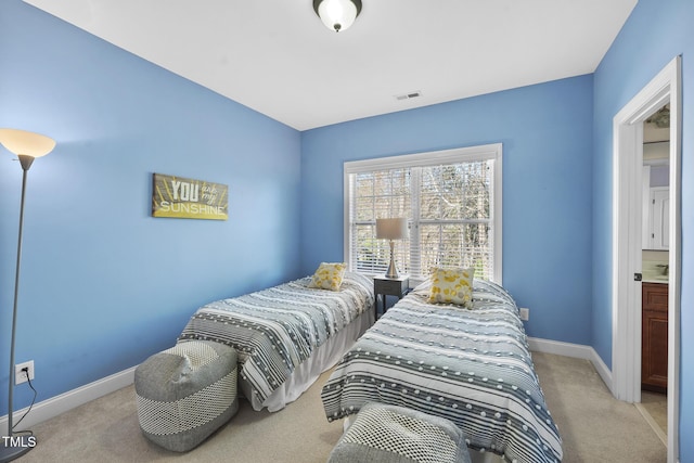 bedroom featuring carpet flooring, visible vents, and baseboards