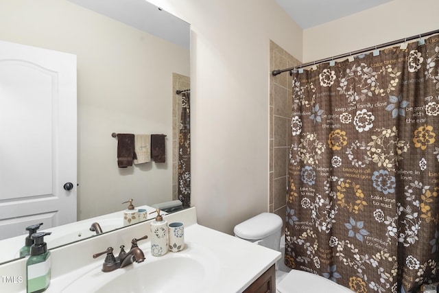 bathroom featuring a shower with curtain, vanity, and toilet