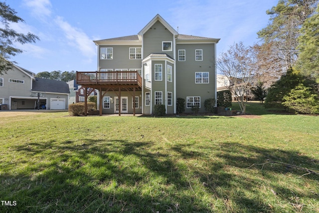 back of property with a deck and a lawn