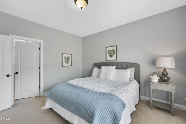 bedroom with carpet and baseboards