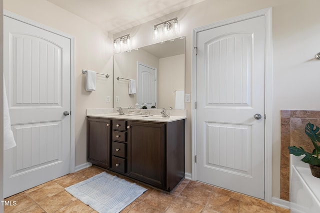 bathroom featuring double vanity and a sink