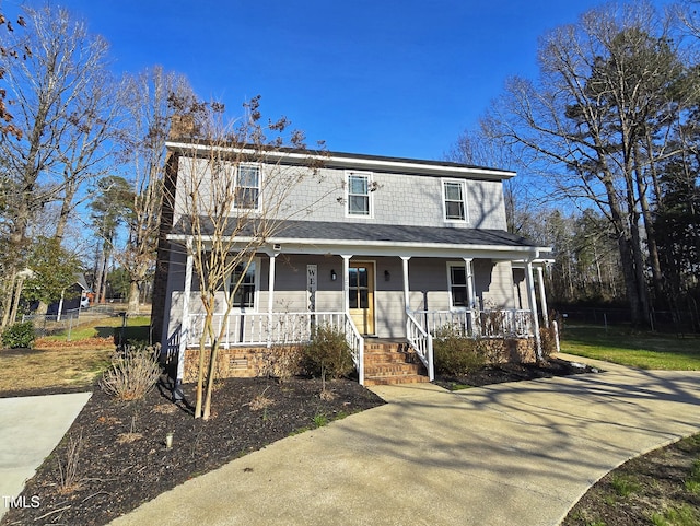 view of front of home with crawl space and a porch