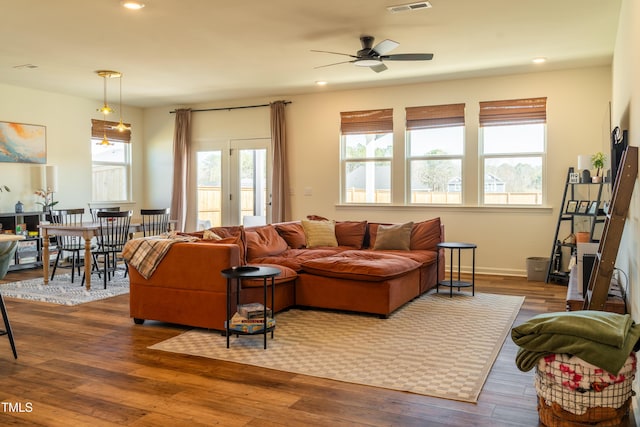 living area with recessed lighting, a ceiling fan, baseboards, visible vents, and dark wood finished floors