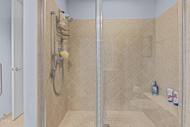 bathroom with a shower stall