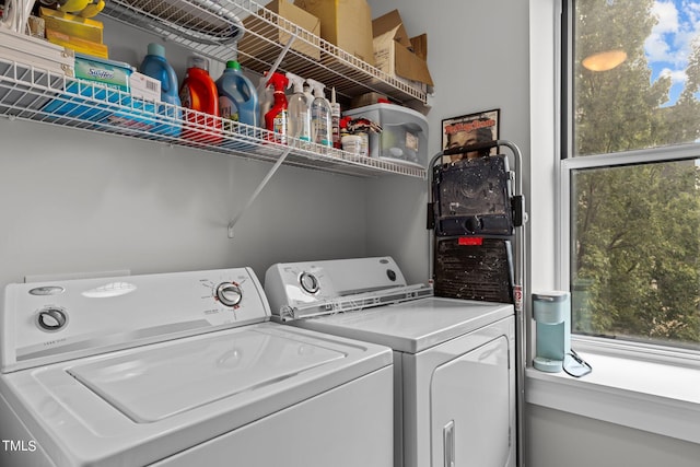 clothes washing area with washer and dryer and laundry area