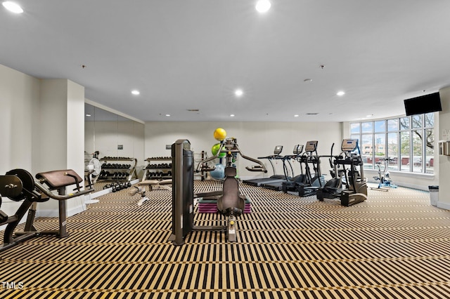 gym featuring carpet, baseboards, and recessed lighting