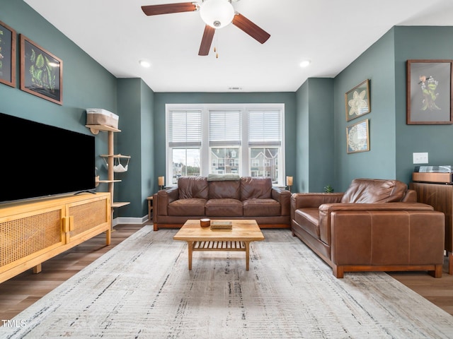 living room with recessed lighting, wood finished floors, visible vents, a ceiling fan, and baseboards