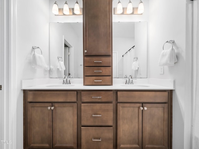 full bathroom featuring a sink and double vanity