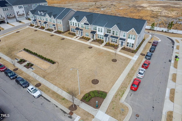 birds eye view of property with a residential view