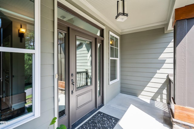 entrance to property featuring covered porch