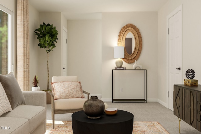 sitting room featuring carpet floors and baseboards