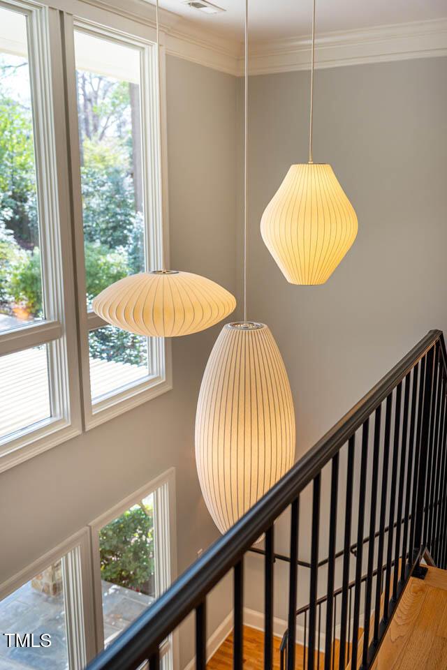 room details with crown molding and wood finished floors