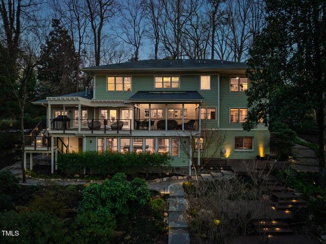 back of property featuring stairway