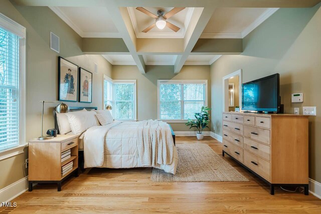 bedroom with visible vents, beamed ceiling, coffered ceiling, light wood finished floors, and baseboards