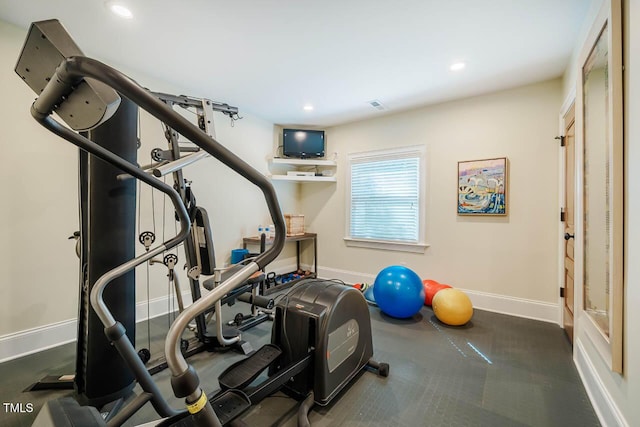 exercise area with visible vents, recessed lighting, and baseboards