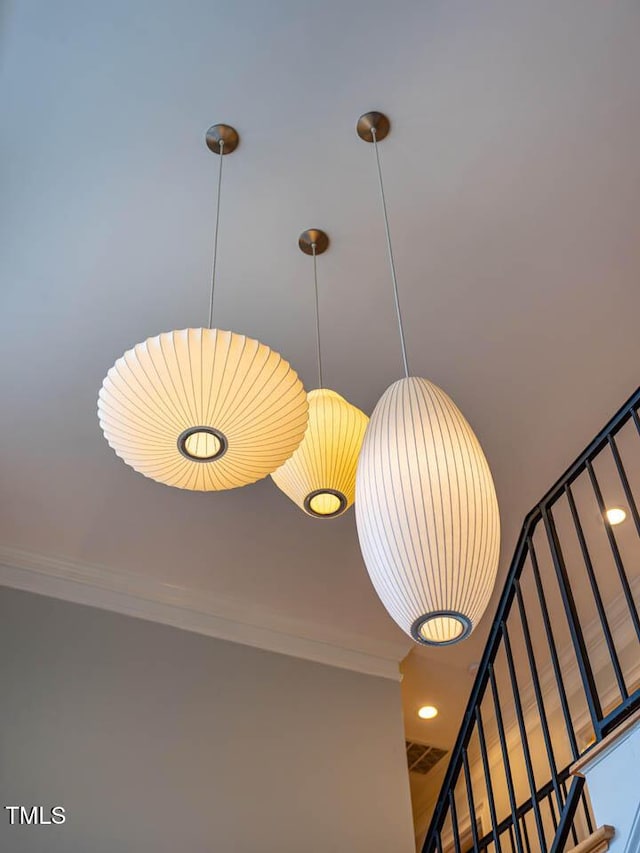 interior details with visible vents and crown molding