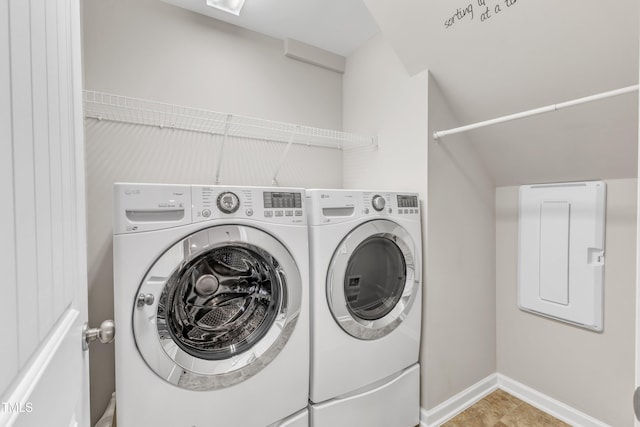 washroom featuring laundry area, electric panel, independent washer and dryer, and baseboards